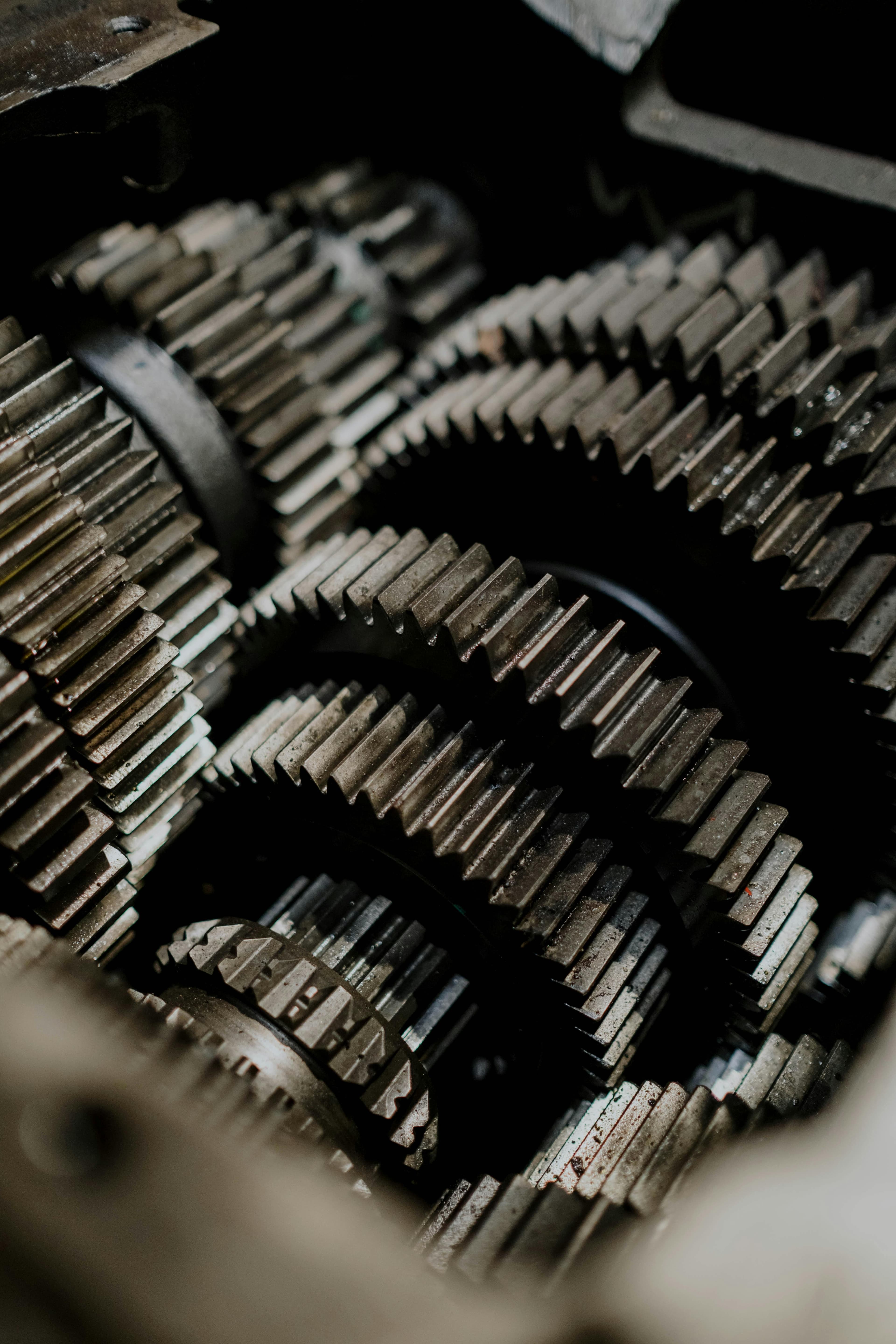 Close-up of lubricated open gears on heavy machinery