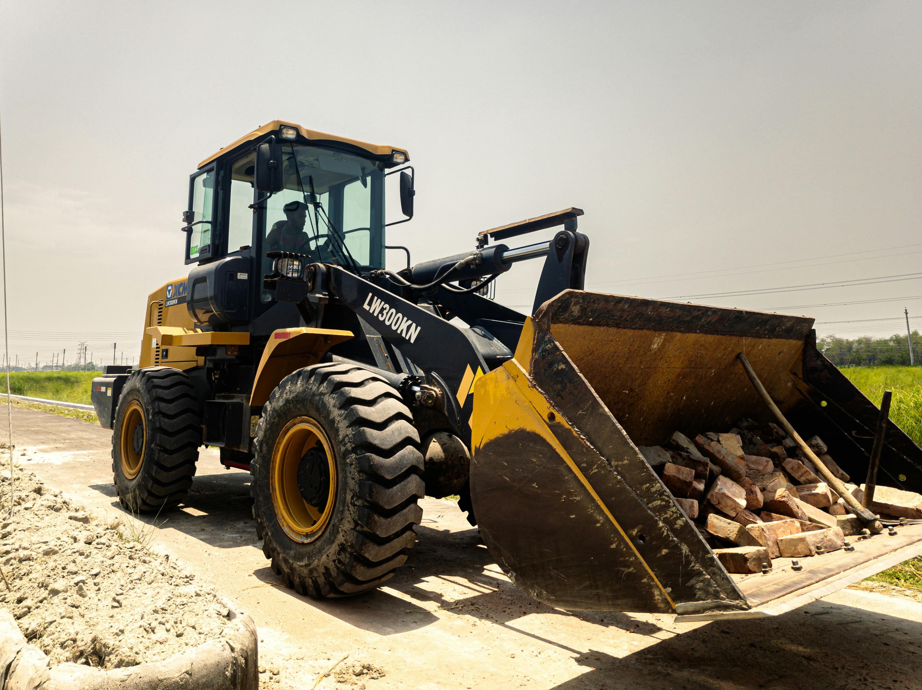 Front loader vehicle moving materials